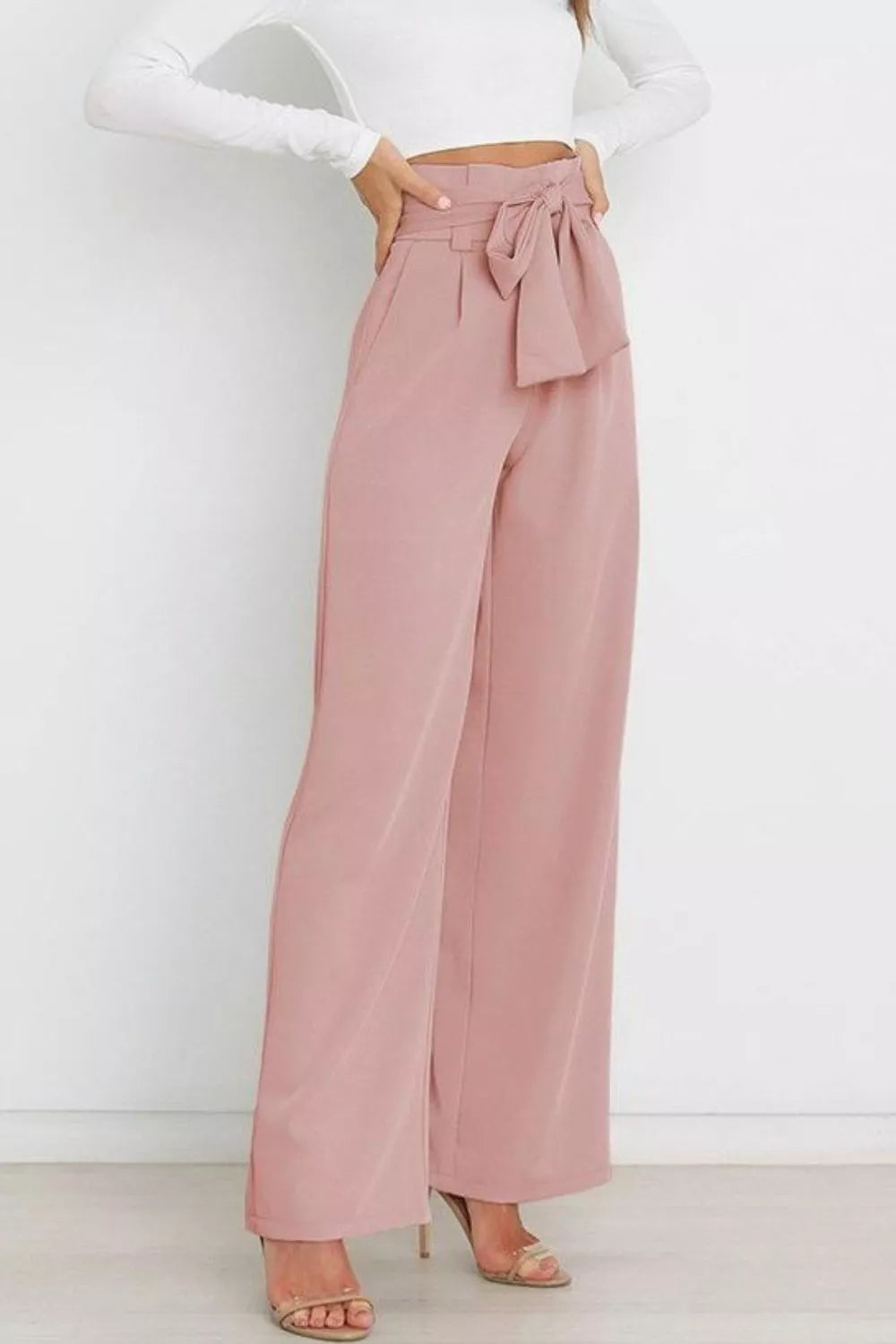 Blush pink high-waist tie-front wide-leg pants with front tie bow and pleated waist
