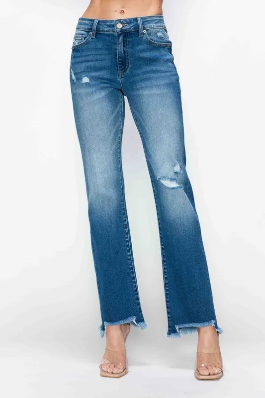 Medium-wash mid-rise straight jeans with ripped details and frayed raw hem