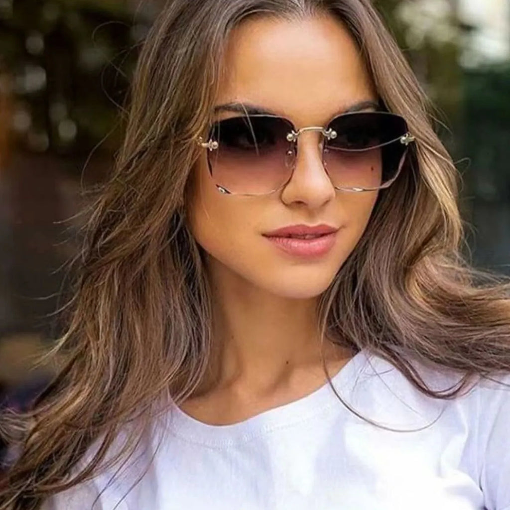 Square gradient sunglasses on model, dark lenses, thin dark frame with gold hardware