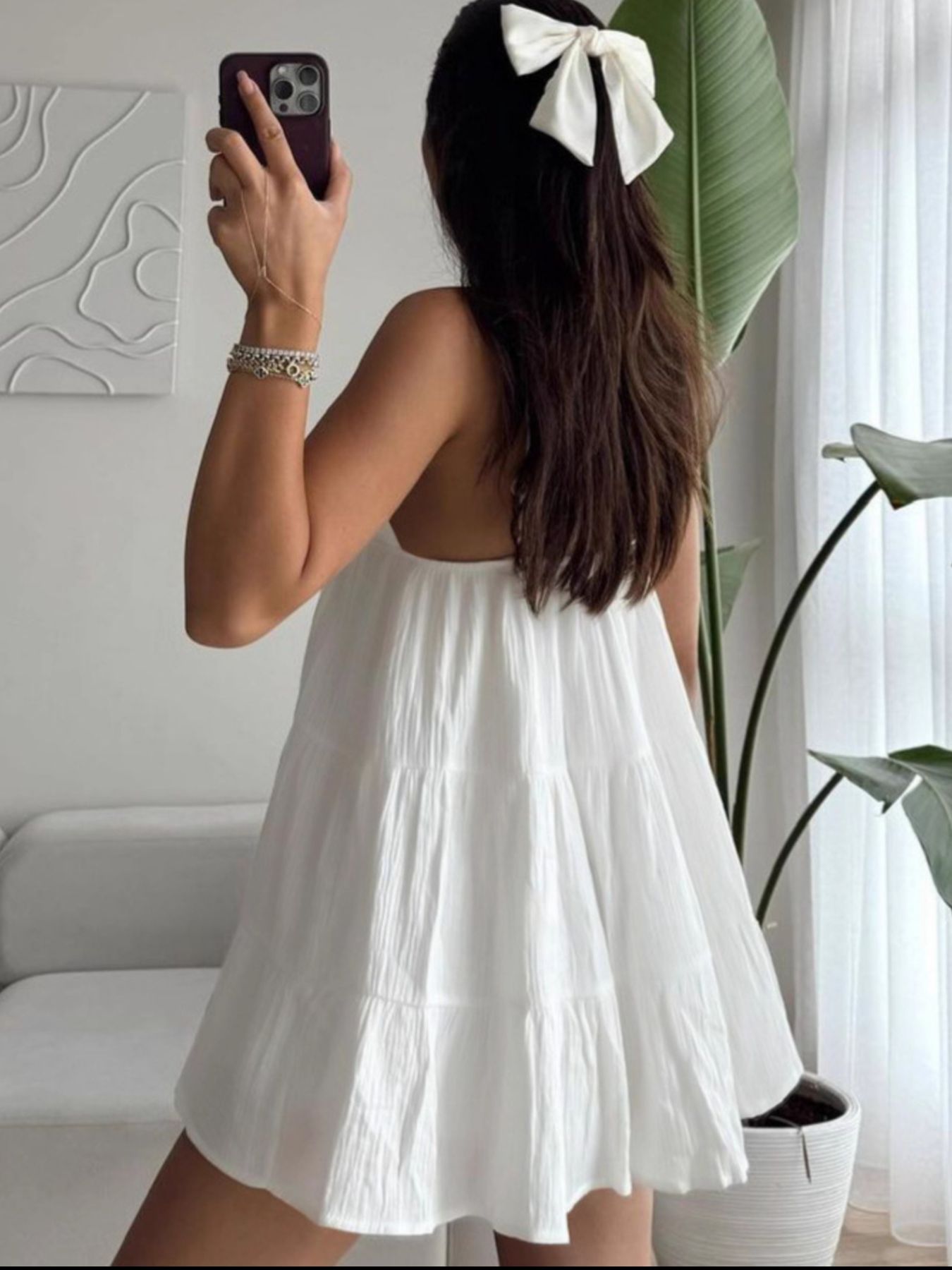 White V-neck tiered mini dress with lace-trim straps and gathered tiered skirt
