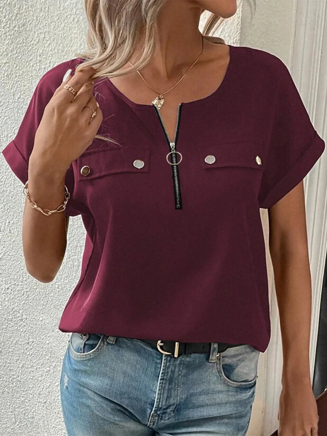 Burgundy short-sleeve blouse with front zipper and chest snap pockets