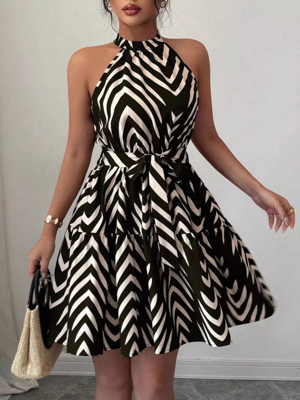 Black zebra-print halter neck tie-waist dress with full skirt and ruffle hem