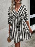 Striped geometric V-neck mini dress with cinched waist and flared A-line skirt