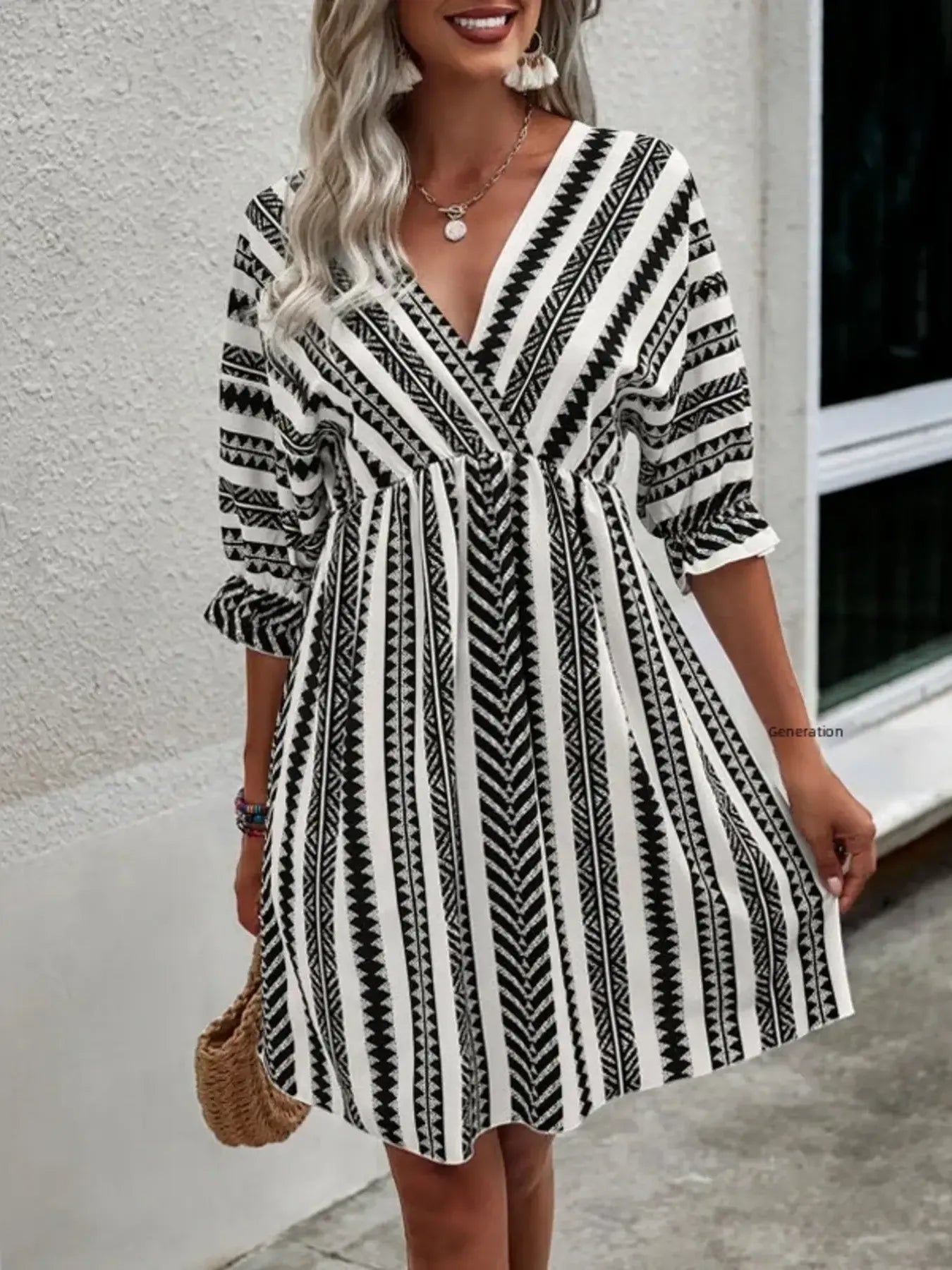Striped geometric V-neck mini dress with cinched waist and flared A-line skirt