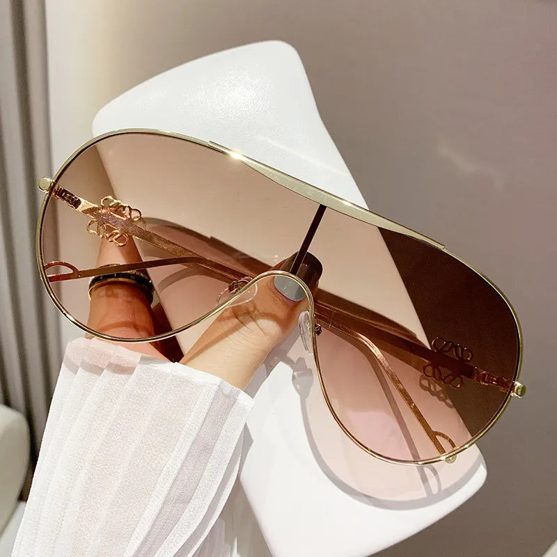 Aviator sunglasses with gold-tone frame and gradient brown-tinted lenses