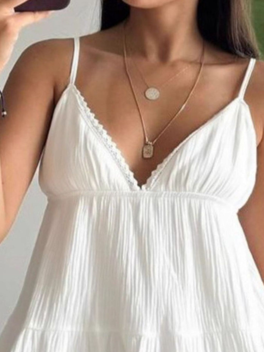 White V-neck tiered mini dress with lace-trim V neckline and thin spaghetti straps
