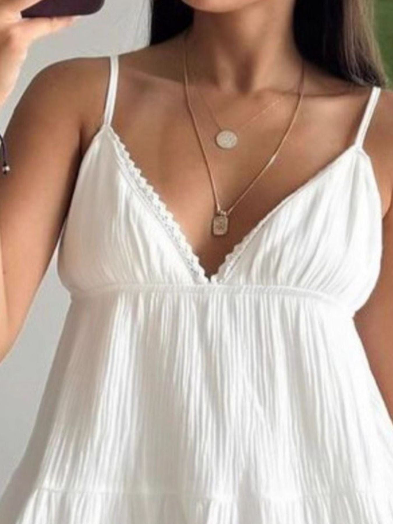 White V-neck tiered mini dress with lace-trim V neckline and thin spaghetti straps