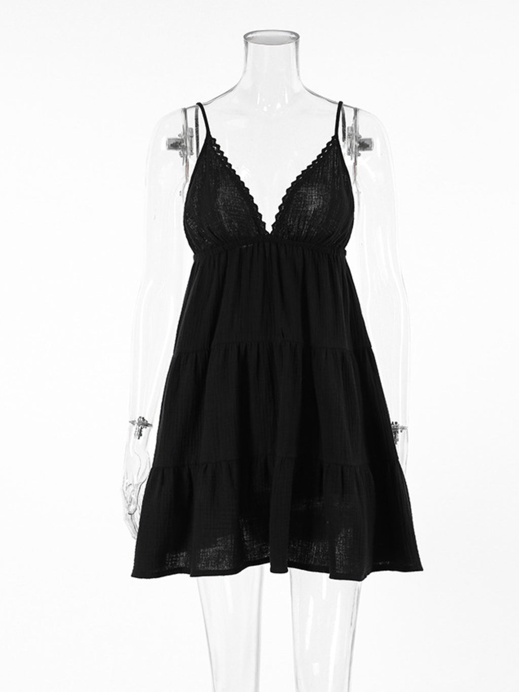 Black V-neck tiered mini dress on mannequin with lace bust and thin straps