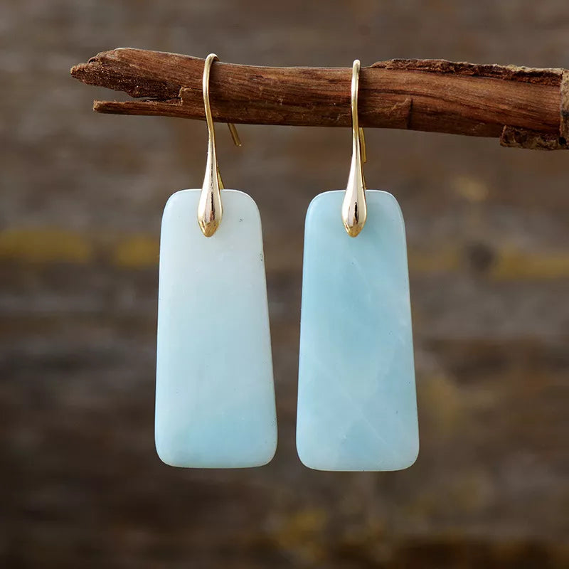 Light blue rectangular stone drop earrings with gold-tone hooks