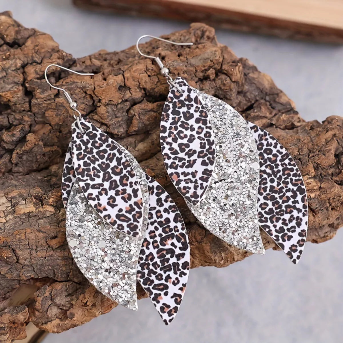 Leopard print leaf drop earrings with silver glitter inset and fishhook backs