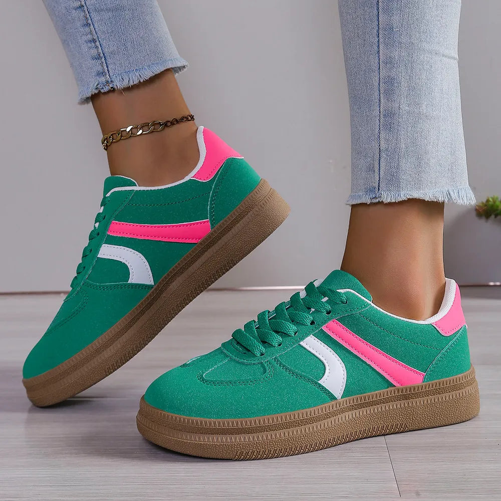 Green and pink platform sneakers with white side stripe, lace-up with brown sole
