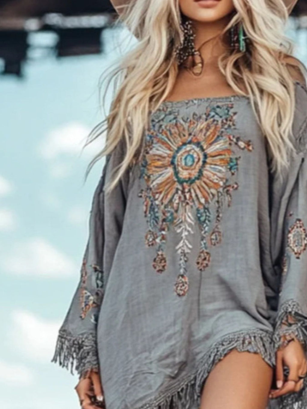 Grey long sleeve mini dress with fringe cuffs and bold central embroidery