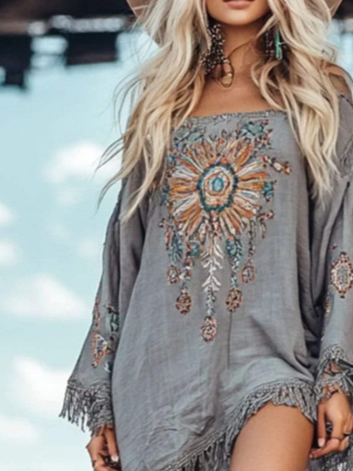 Grey long sleeve mini dress with fringe cuffs and bold central embroidery