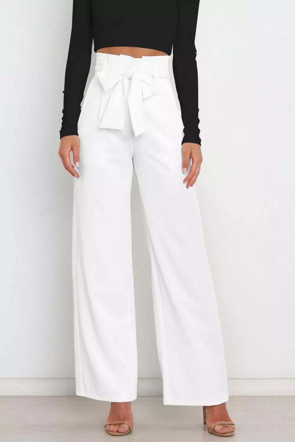 White high-waist wide-leg pants with front bow tie and side pockets