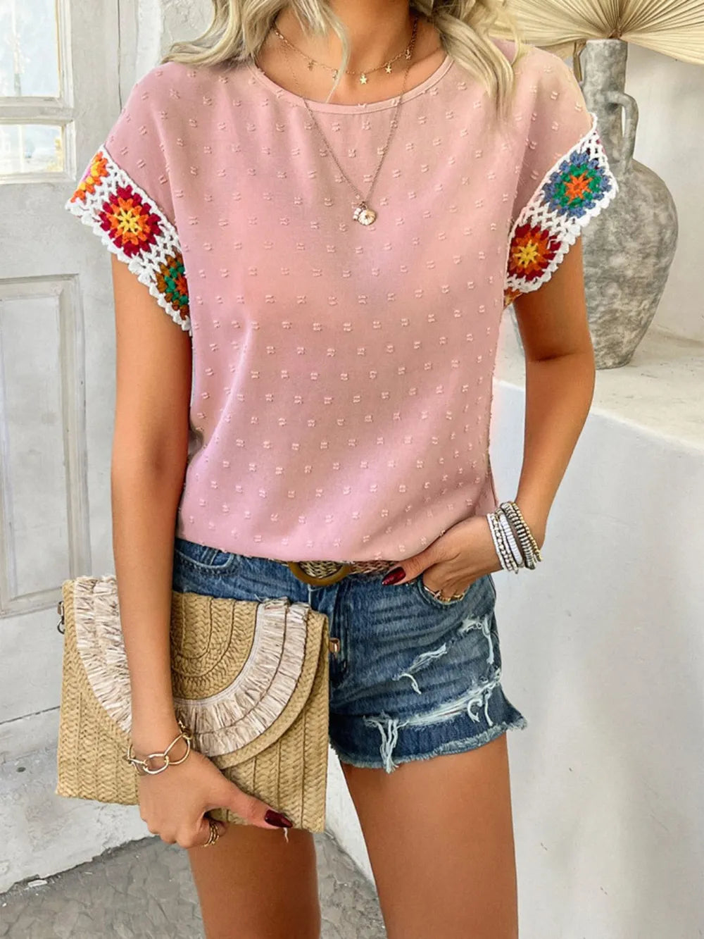 Blush pink Swiss dot round neck crochet short sleeve top with colorful embroidered sleeve trim