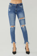 Dark blue slim jeans with ripped knees and frayed hem