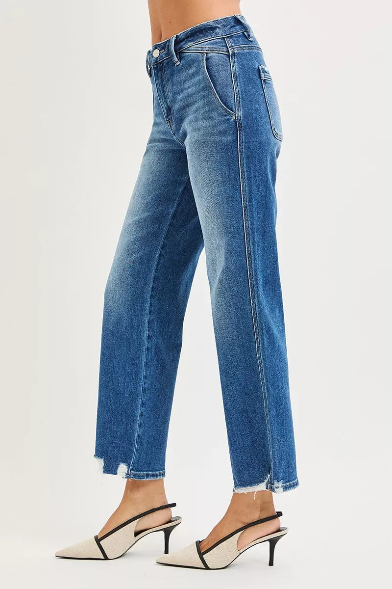 Side view: medium wash high-rise straight jeans with distressed ankle hem