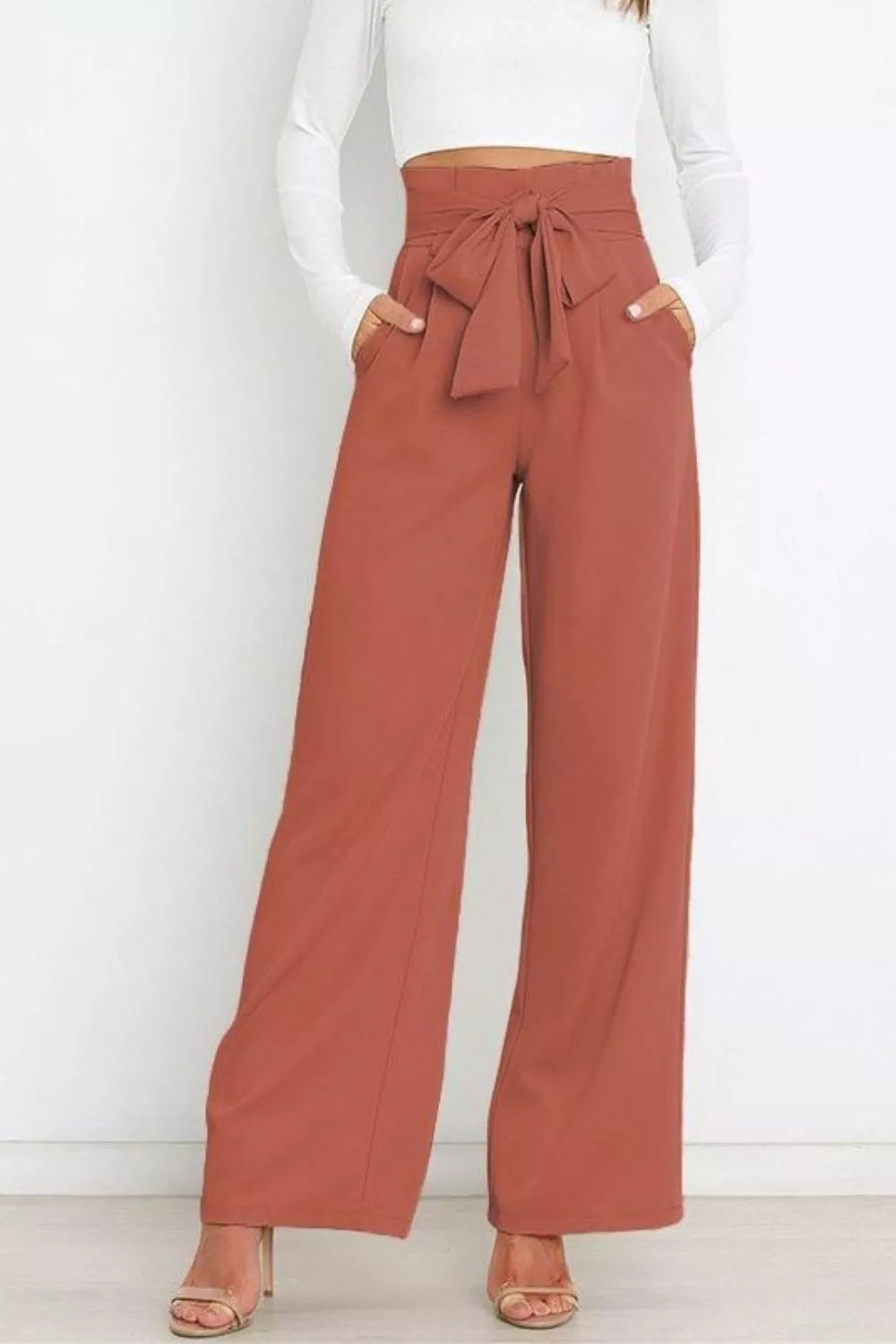 Brick red high-waist tie-front wide-leg pants with gathered waist and center bow