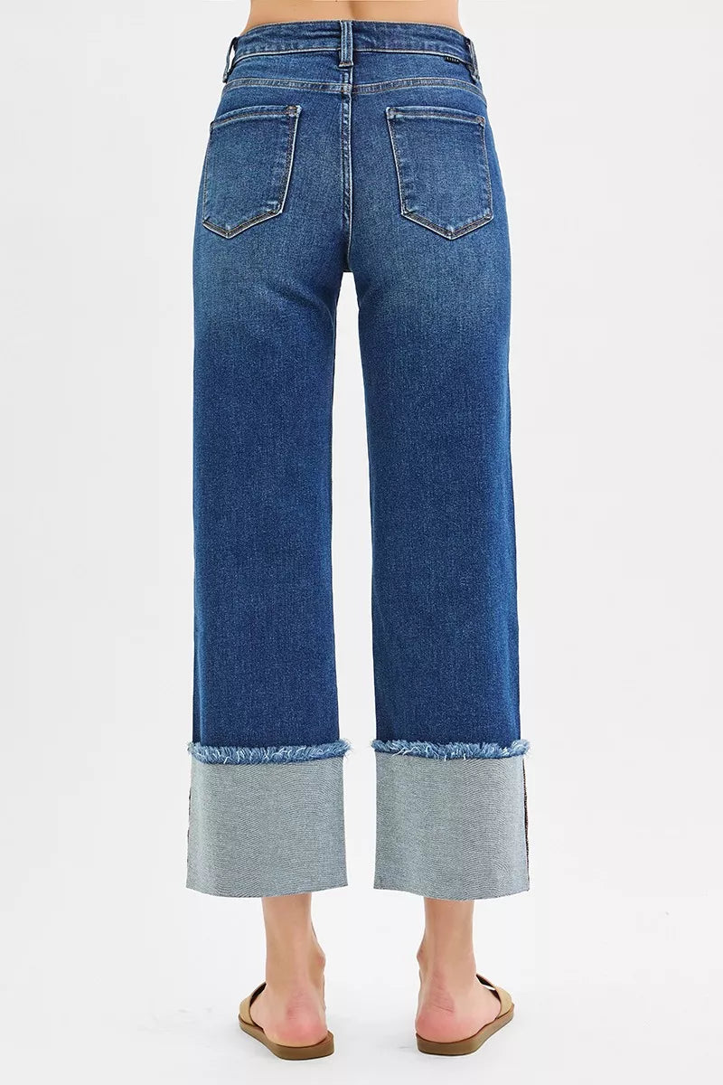 Dark blue back view wide crop jeans with belt loops and cuffed hem