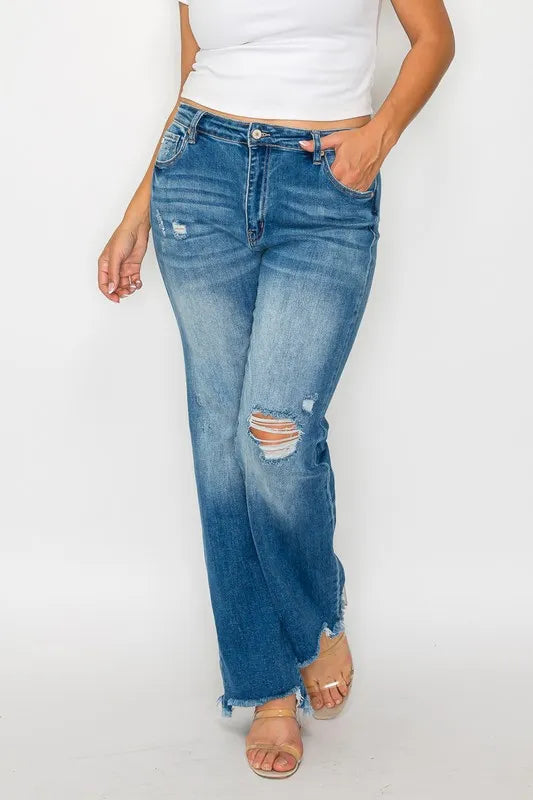 Medium-wash mid-rise straight jeans with distressed rips and raw hem cuffs