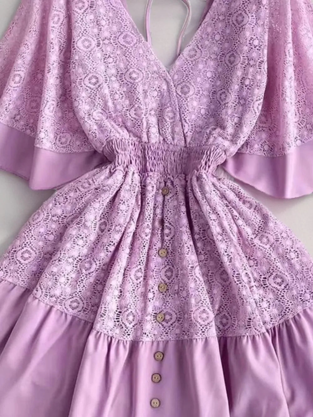 Lavender lace mini dress with ruffle hem, gathered waist, and button front