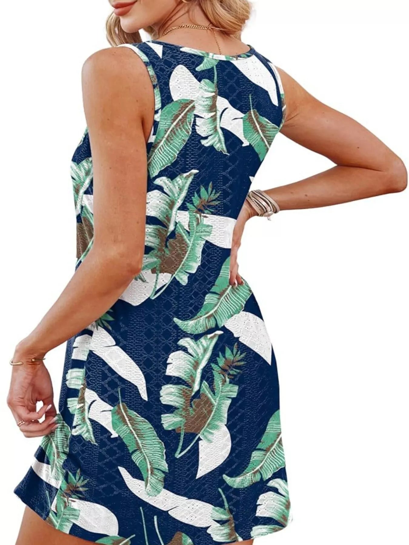 Navy sleeveless tank dress with tropical leaf print, shown from the back.