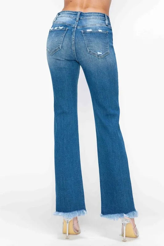 Back view of medium-wash straight jeans with distressed wear and frayed raw hem