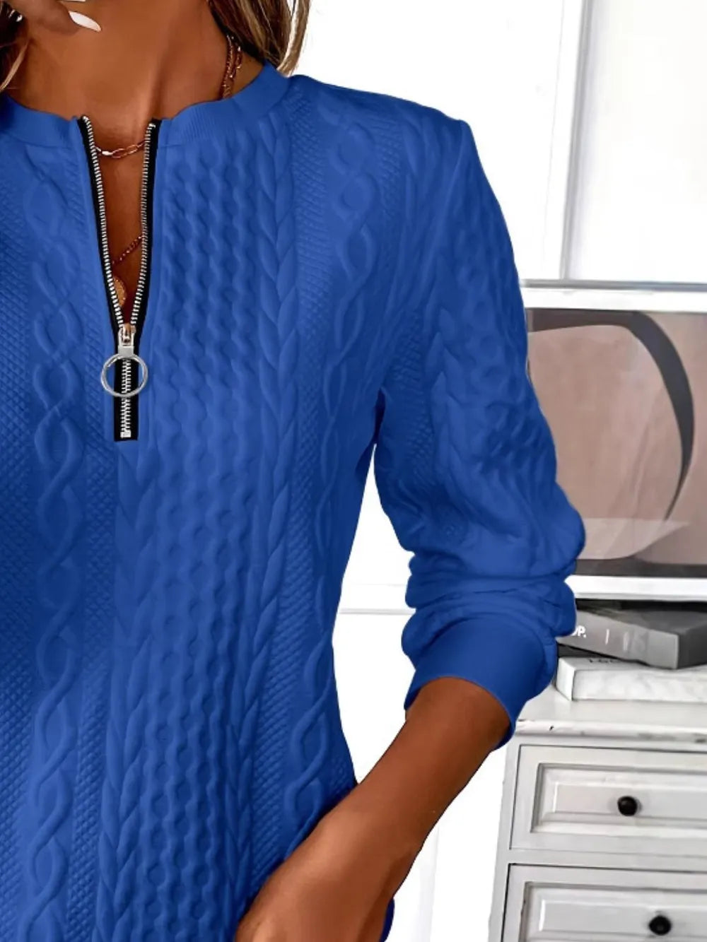 Blue textured half-zip sweatshirt with silver zipper and mock stand collar