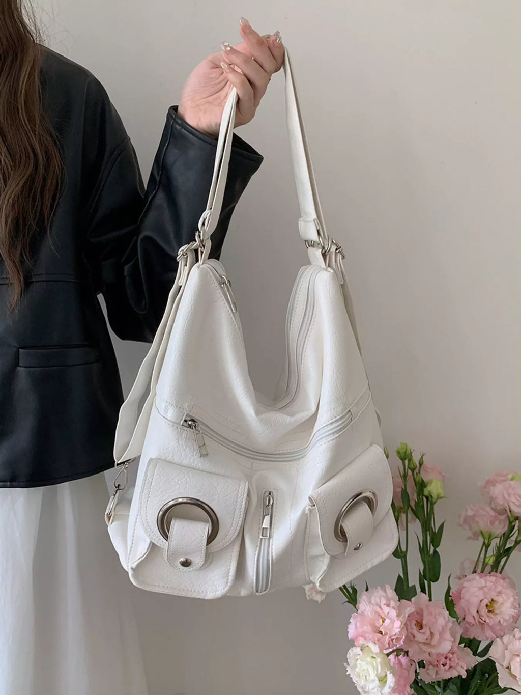 Convertible pocket handbag, white; front compartments with ring accents and zip closure