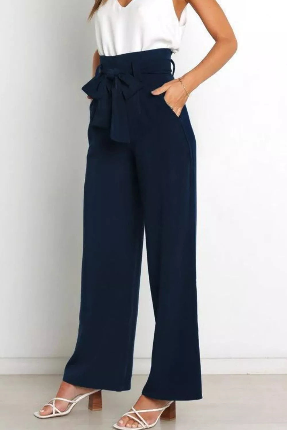 Dark navy high-waist wide-leg pants with front bow tie at waist
