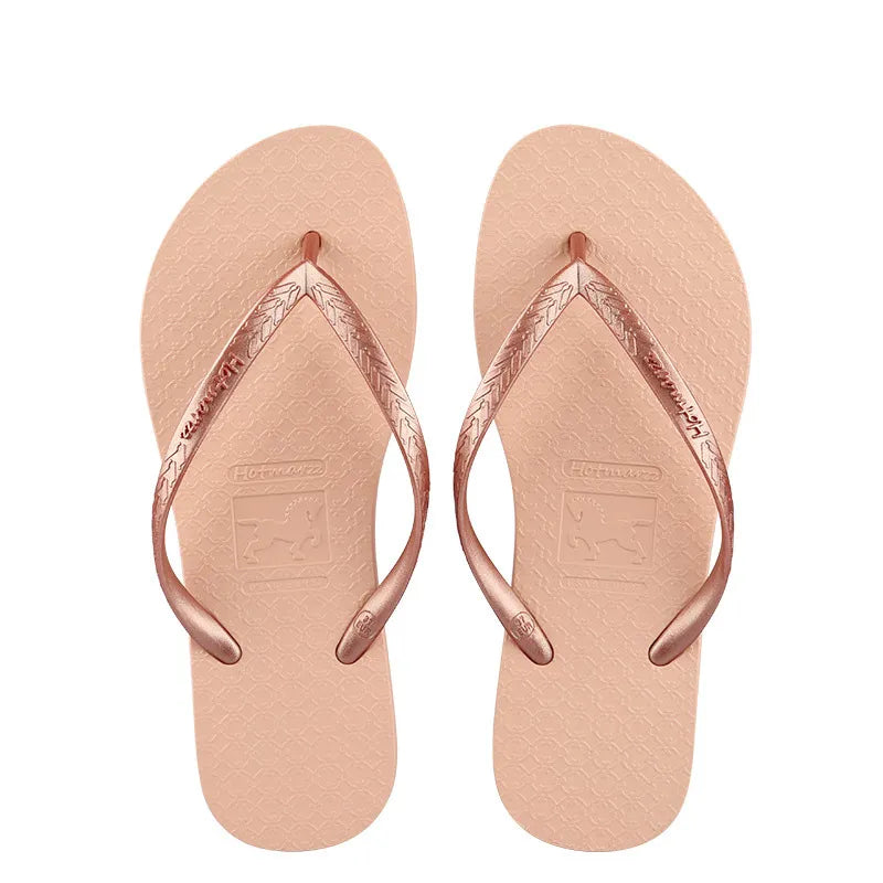 Rose pink toe-post flat sandals with textured thong straps