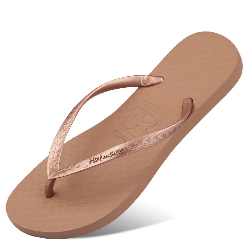 Coffee/tan toe-post flat sandals with textured footbed and thong strap