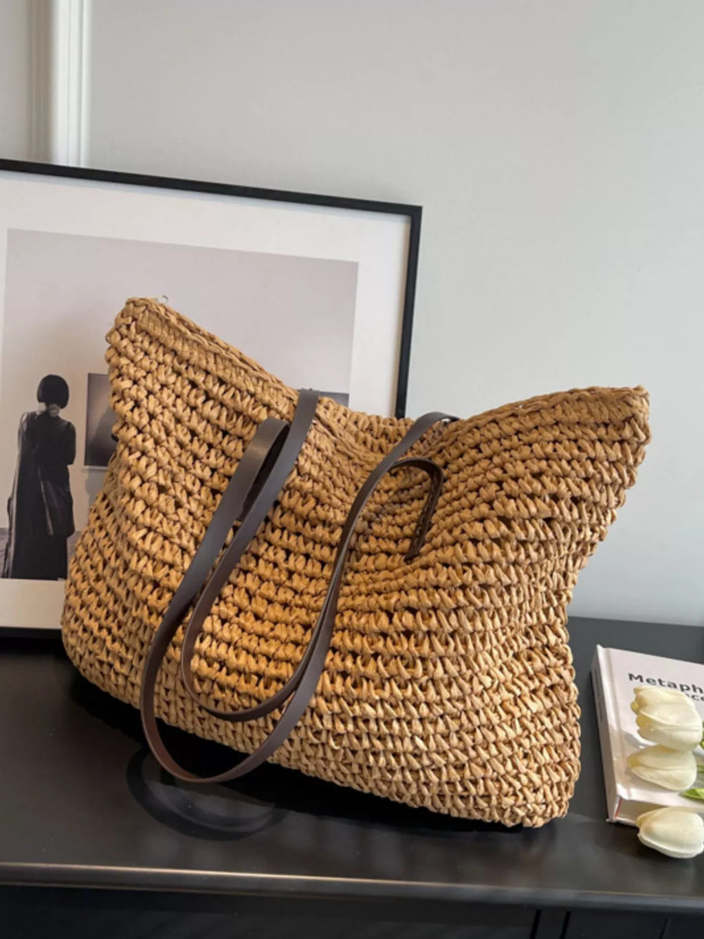 Woven straw shoulder bag with black shoulder strap, woven basket tote in caramel brown