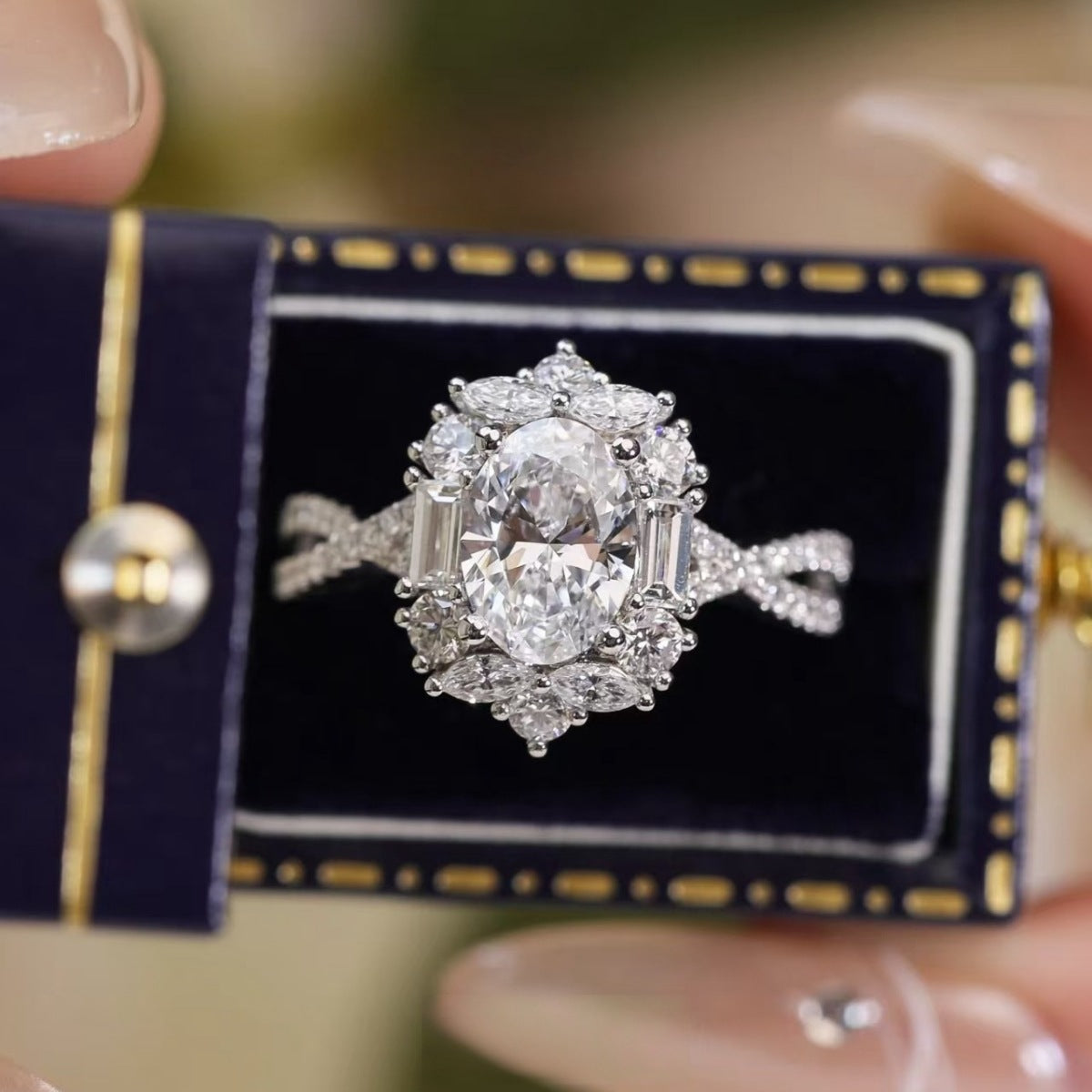 Moissanite halo ring on jewelry box: round center stone with micro pavé border