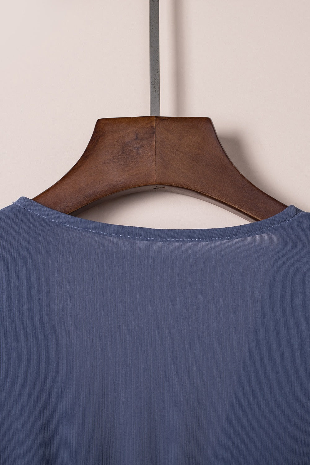 Dusty blue V-neck mini dress with ruffle hem