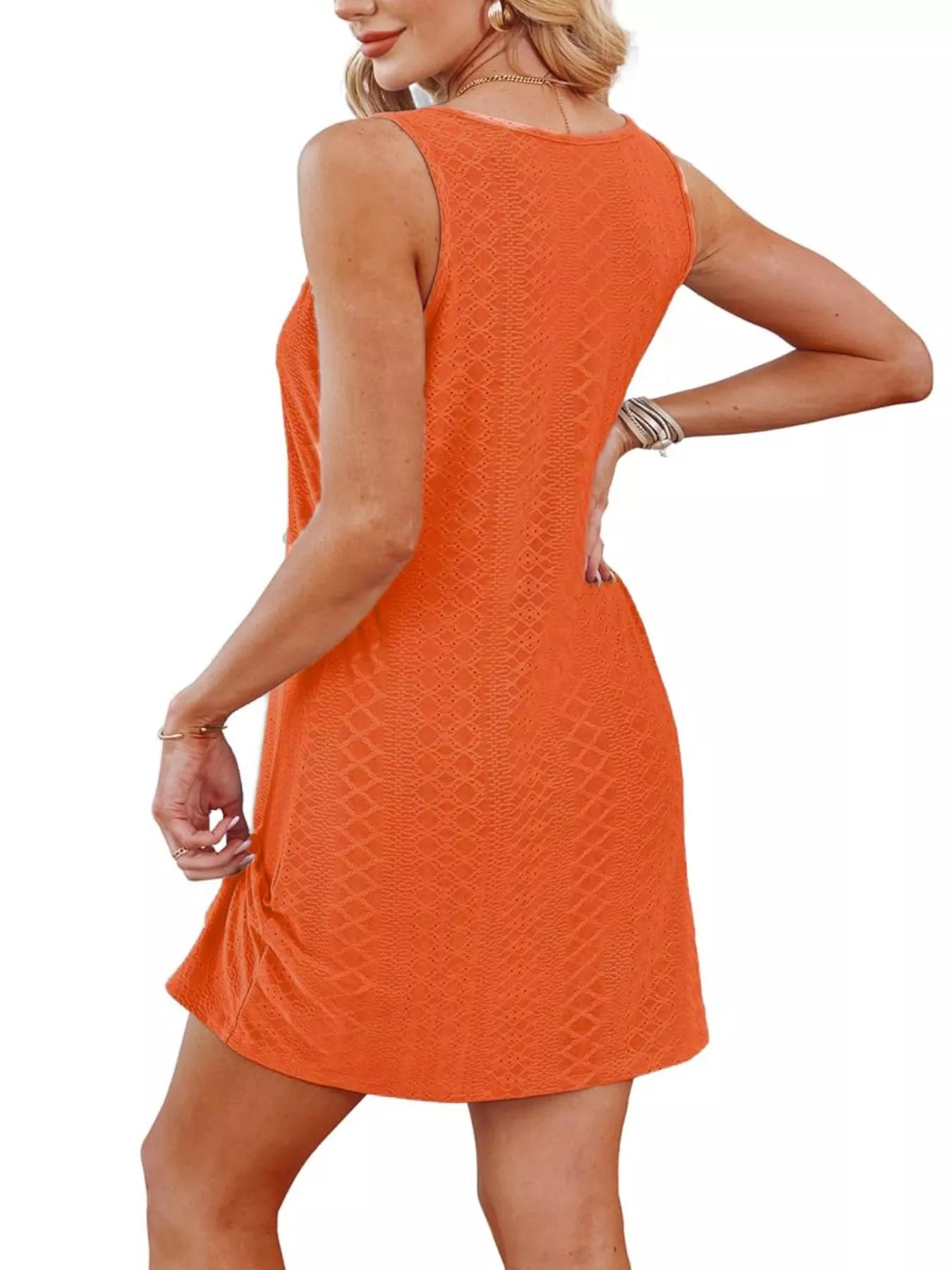 Orange sleeveless tank dress with knotted hem and textured pattern, back view