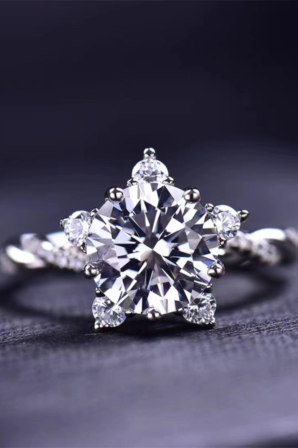3-carat moissanite twisted ring with large round center stone and side accents, silver