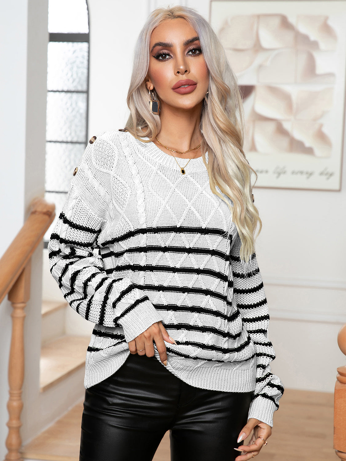 White/cream striped cable-knit sweater with round neck and black horizontal bands