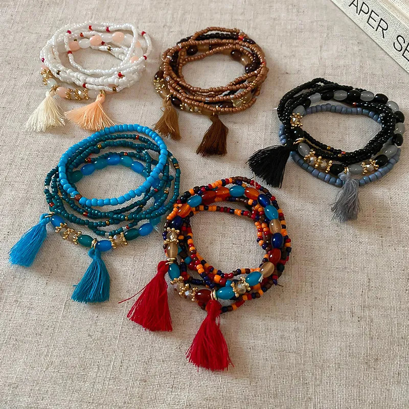 Tassel bead bracelet set in blue, brown, and black with tassels and beaded wraps
