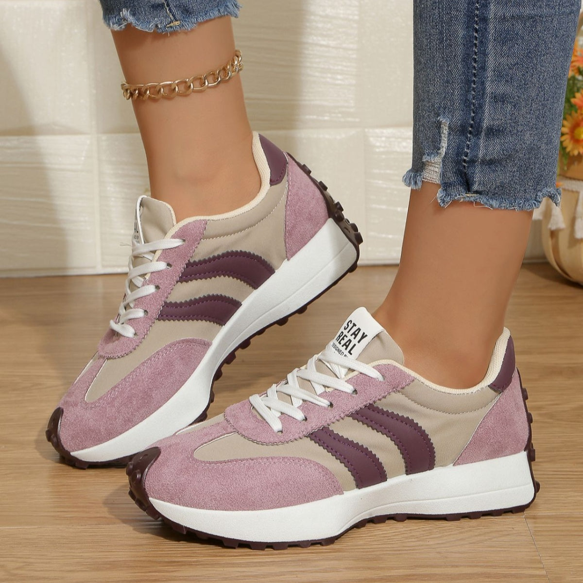 Pink and beige lace-up sneakers with purple stripe accents, round toe, brown traction sole
