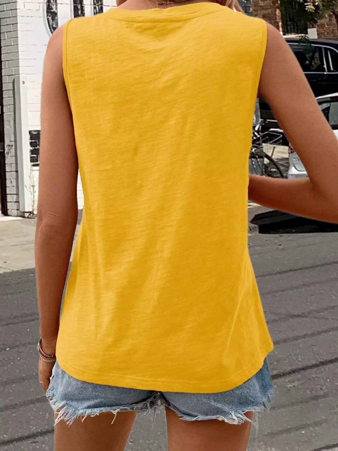 Yellow V-neck tank top, back view with sleeveless shoulders