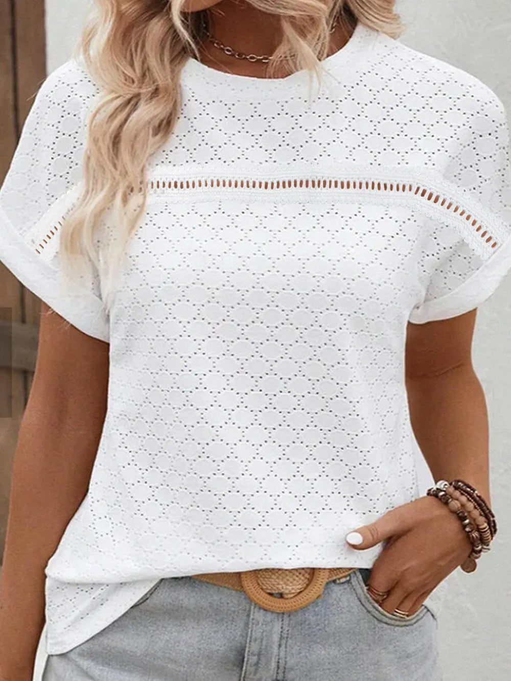 White eyelet short-sleeve blouse with round neckline, scalloped cutout pattern