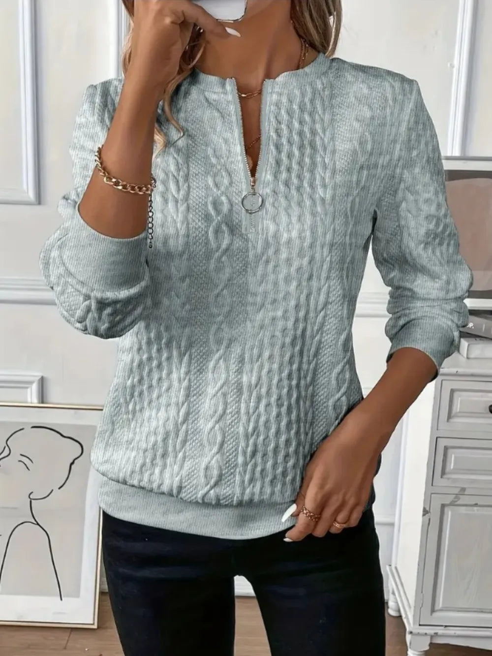 Gray textured half-zip long-sleeve sweatshirt with ribbed cuffs and hem