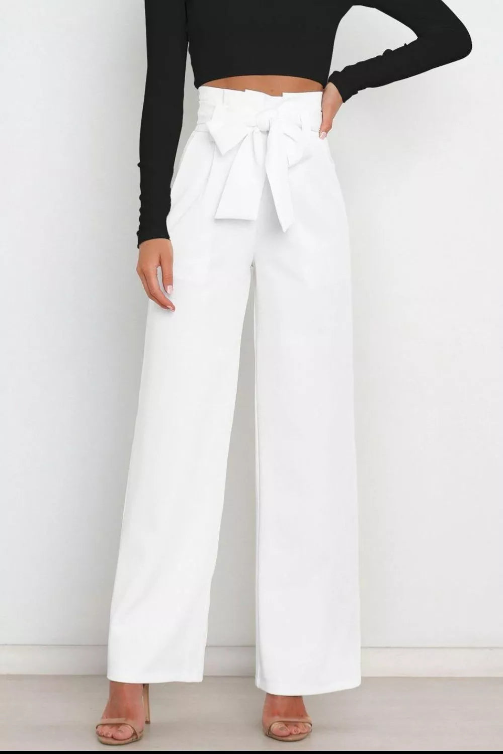 White high-waist wide-leg pants with bow-tied waistband detail