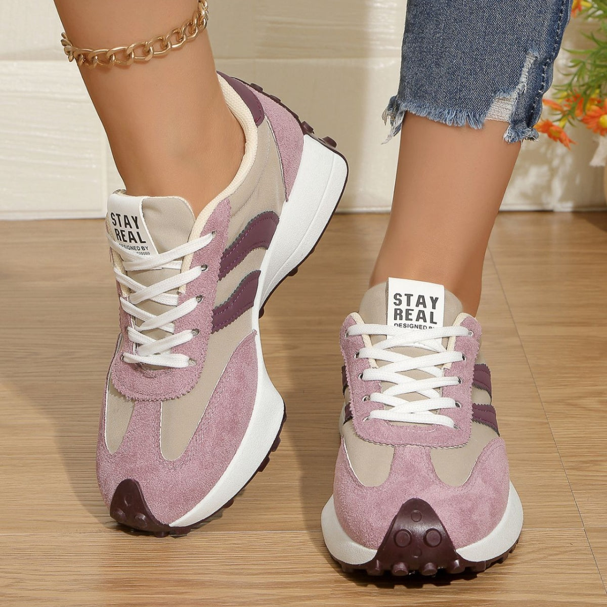 Pink and beige lace-up sneakers with purple stripe accents, round toe, grippy outsole