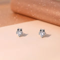 Silver owl stud earrings with round crystal body and black eyes, side-by-side view