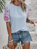 Embroidered puff-sleeve blouse, light blue with pink floral embroidery on sleeves