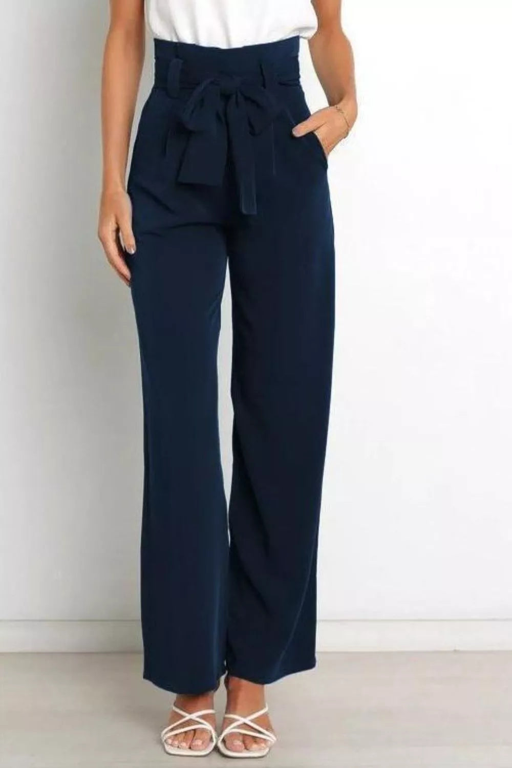 Dark navy high-waist wide-leg pants with front tie bow at waistband