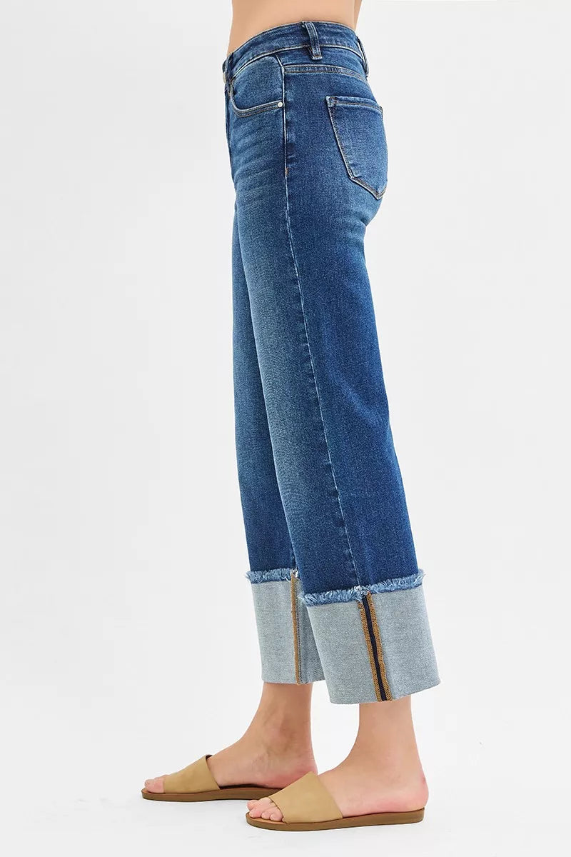 Dark blue side view wide-leg crop jeans with cuffed hem and back yoke seam