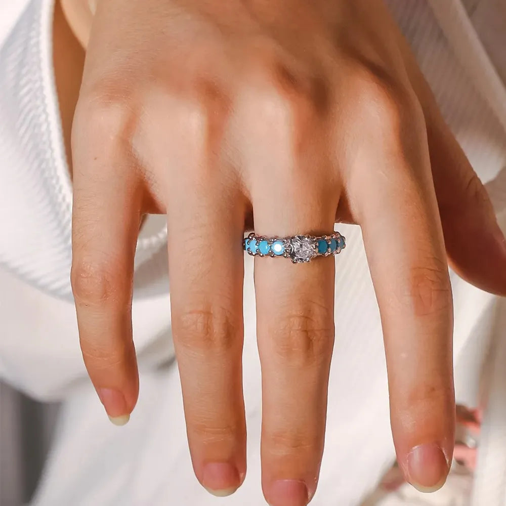Turquoise inlay and silver-tone band ring with sparkling center zircon